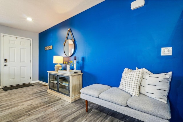 sitting room with hardwood / wood-style floors