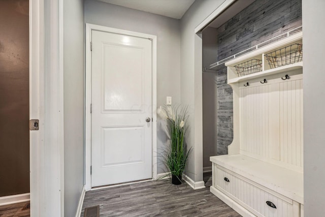 mudroom with dark hardwood / wood-style floors