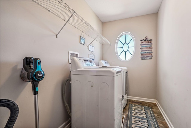 clothes washing area featuring washer and clothes dryer