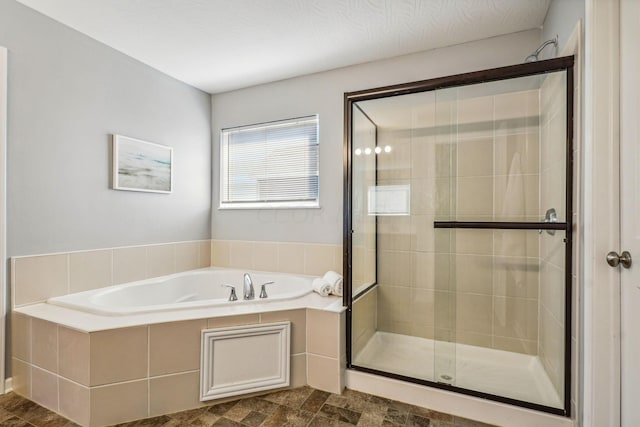 bathroom featuring separate shower and tub