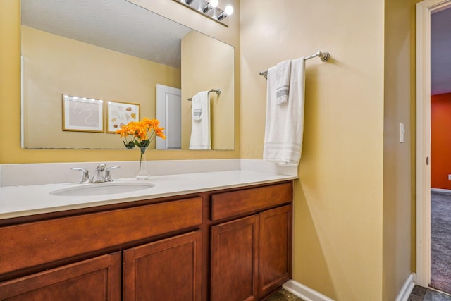 bathroom featuring vanity and a textured ceiling