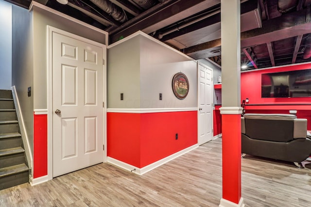 basement featuring light wood-type flooring