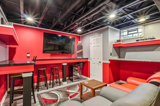 interior space featuring bar and hardwood / wood-style floors