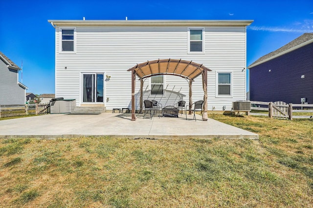 back of property with a yard, a pergola, central AC, and a patio area