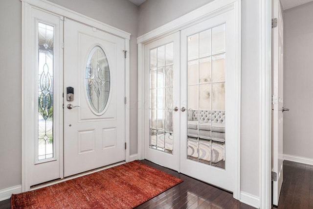 entryway featuring a healthy amount of sunlight and dark wood-type flooring