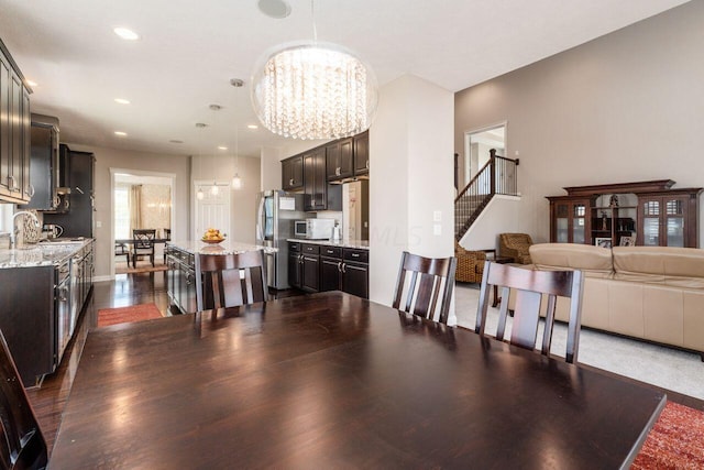 dining area featuring a chandelier, dark hardwood / wood-style floors, and sink