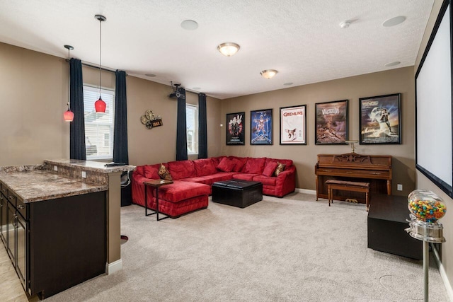 living room featuring light carpet and a textured ceiling