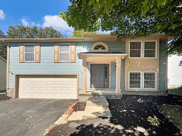 split foyer home featuring a garage