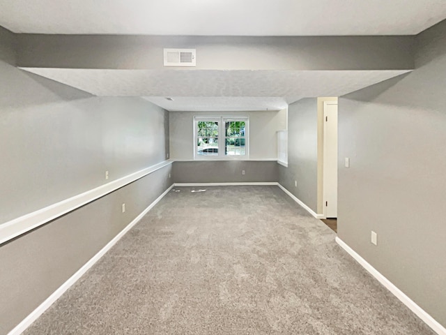 basement featuring carpet floors