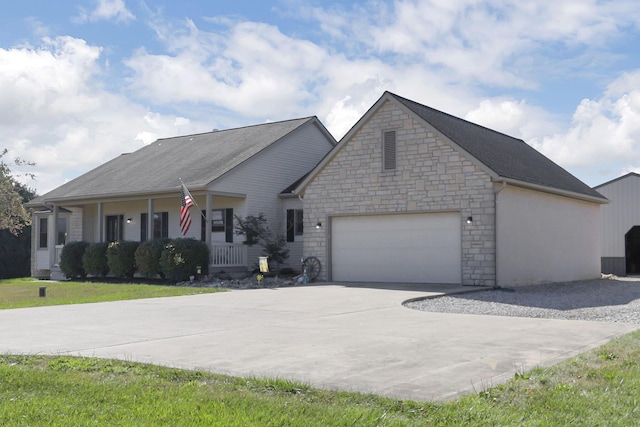 view of front of property with a porch and a garage