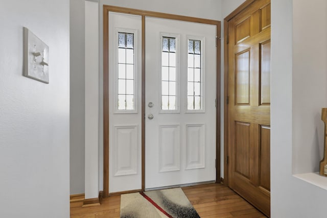 doorway to outside featuring light wood-type flooring