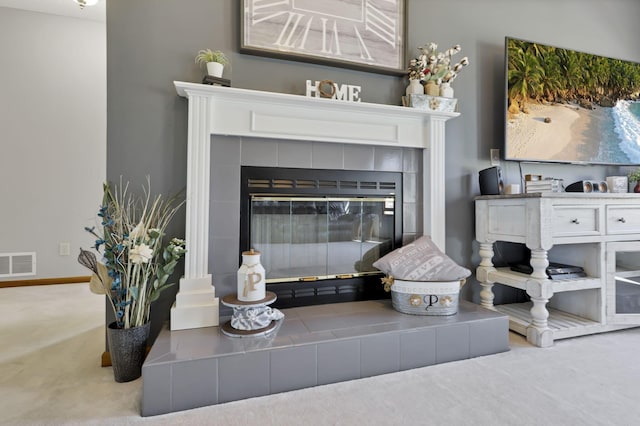 details with carpet flooring and a tile fireplace