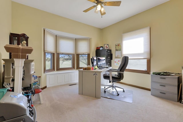 carpeted office with ceiling fan