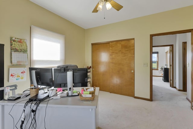 office area featuring ceiling fan and light colored carpet