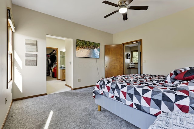 carpeted bedroom featuring a closet and ceiling fan