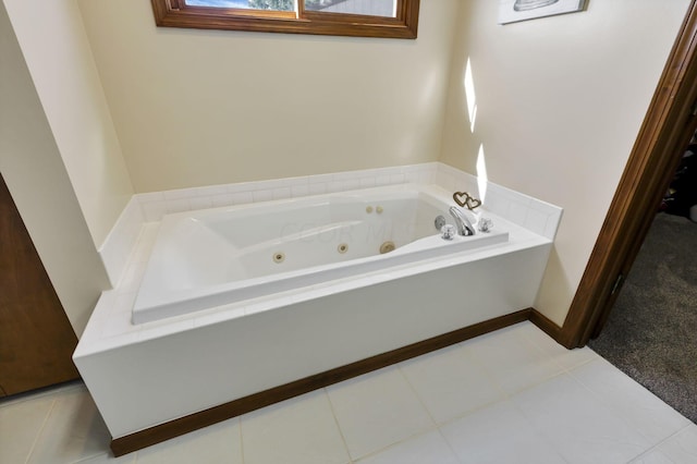 bathroom featuring tile patterned floors and a tub