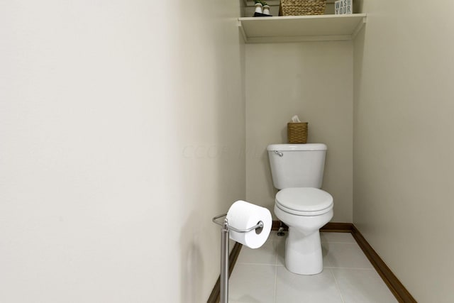 bathroom featuring tile patterned floors and toilet