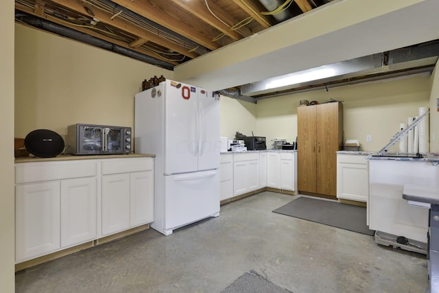 basement with white refrigerator