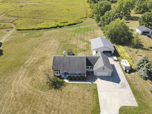 birds eye view of property with a rural view