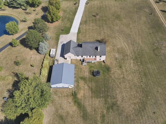 birds eye view of property with a rural view