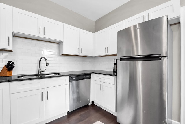 kitchen featuring white cabinets, appliances with stainless steel finishes, and sink