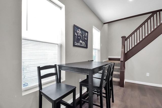 dining area with dark wood-type flooring