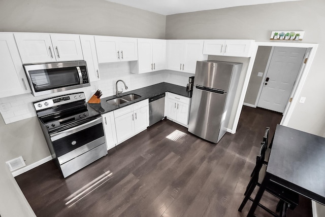 kitchen featuring sink, white cabinets, and stainless steel appliances