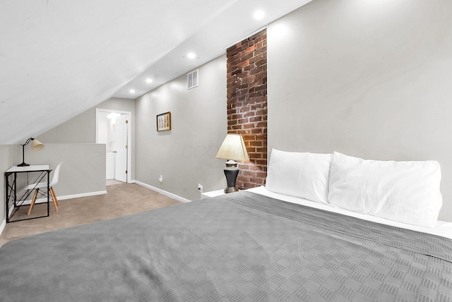 carpeted bedroom with vaulted ceiling