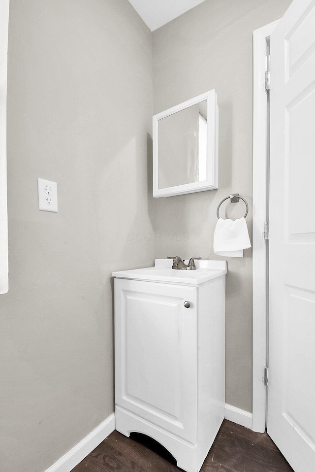 bathroom with vanity and hardwood / wood-style flooring