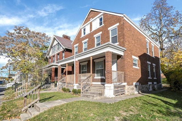 view of front facade with a porch and a front yard