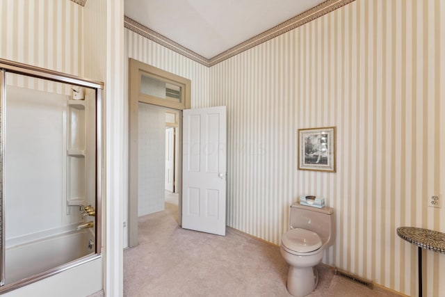 bathroom featuring toilet and bathtub / shower combination