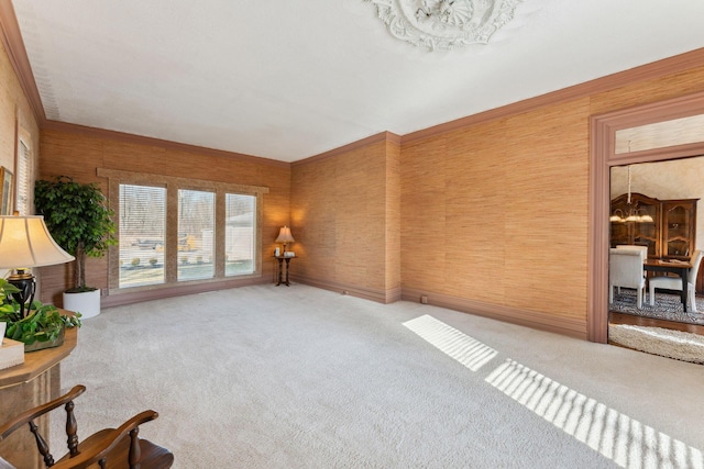 living room featuring wood walls, light colored carpet, and a notable chandelier