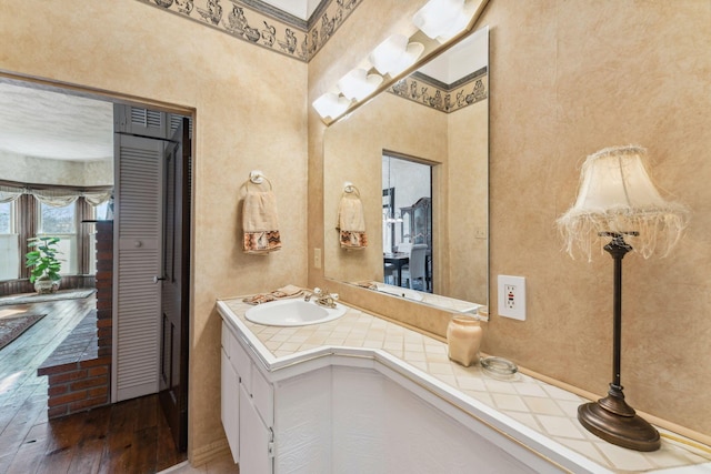 bathroom featuring vanity and hardwood / wood-style flooring