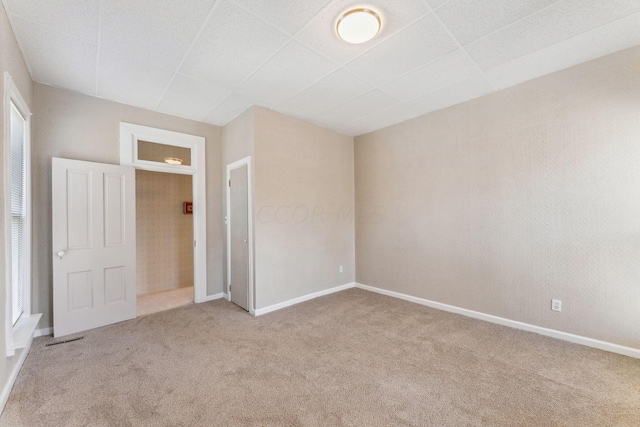 unfurnished bedroom with light carpet