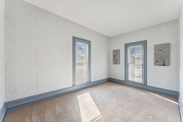 carpeted empty room featuring electric panel