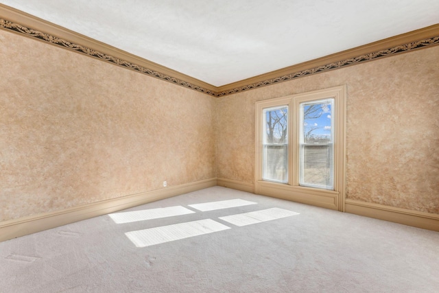 empty room with light colored carpet and ornamental molding