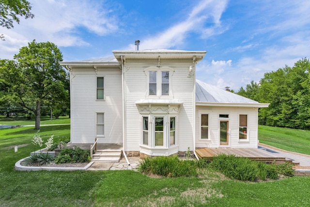 back of house with a yard