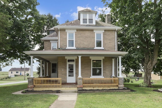 view of front of house with a front lawn and covered porch