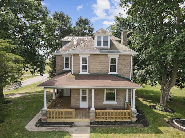 view of front of home featuring a front lawn and a porch