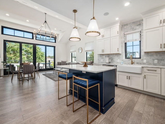 kitchen featuring white cabinetry and a healthy amount of sunlight