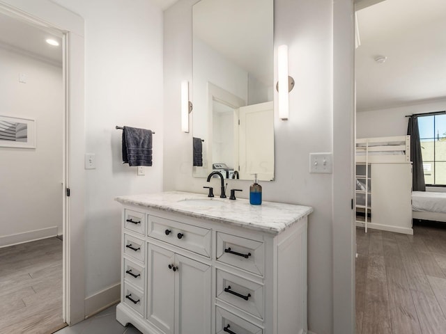 bathroom with vanity and wood-type flooring