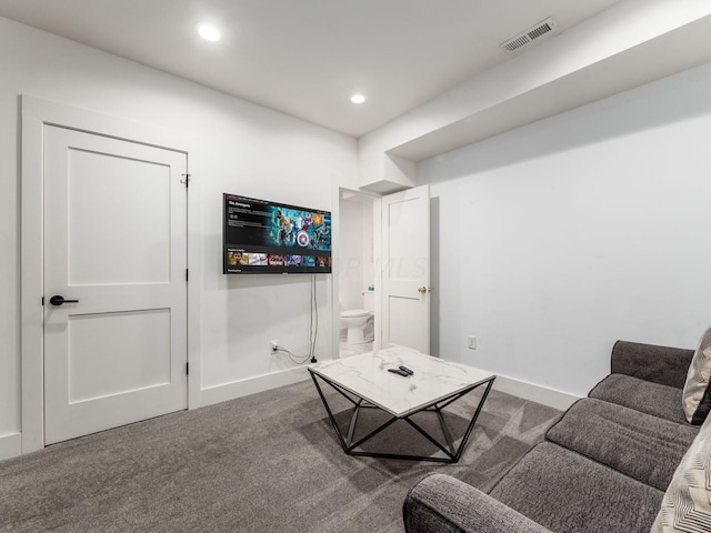 living room with dark carpet