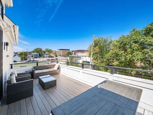 deck featuring outdoor lounge area