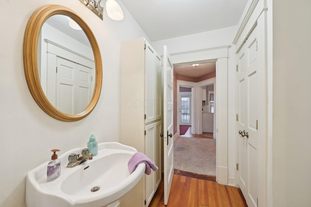 bathroom with sink and hardwood / wood-style floors