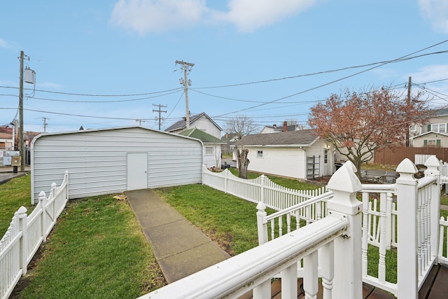 exterior space featuring a lawn and an outdoor structure