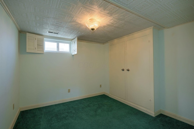 unfurnished bedroom featuring baseboards, visible vents, and an ornate ceiling