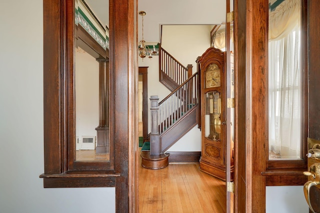 interior space featuring plenty of natural light, stairs, and hardwood / wood-style flooring