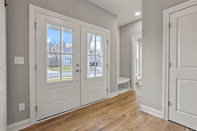 entryway with french doors and light wood-type flooring