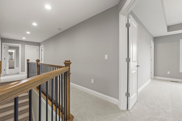 hallway featuring carpet flooring