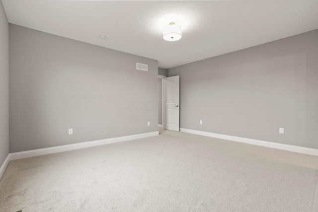 unfurnished room featuring carpet floors